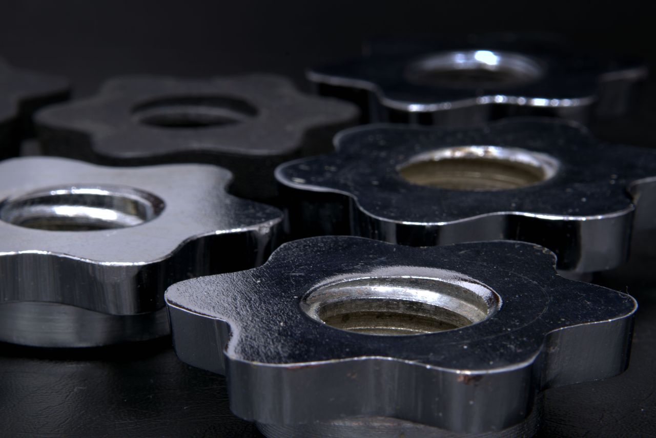 Close-up of shiny chrome machine components showcasing precision engineering.
